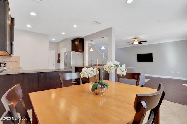 dining room featuring ceiling fan