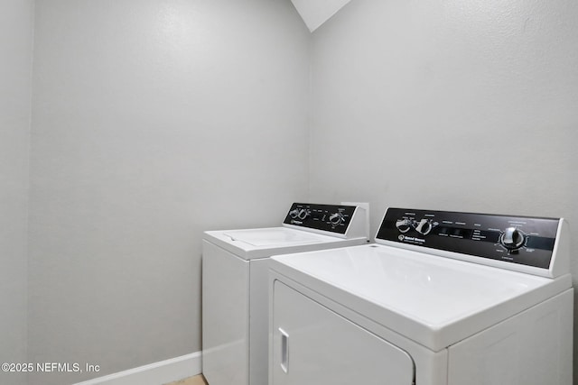 clothes washing area featuring washing machine and clothes dryer