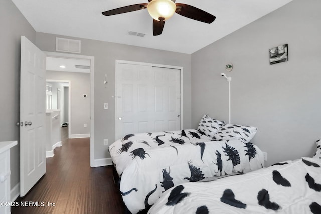 bedroom with ceiling fan, dark hardwood / wood-style flooring, and a closet