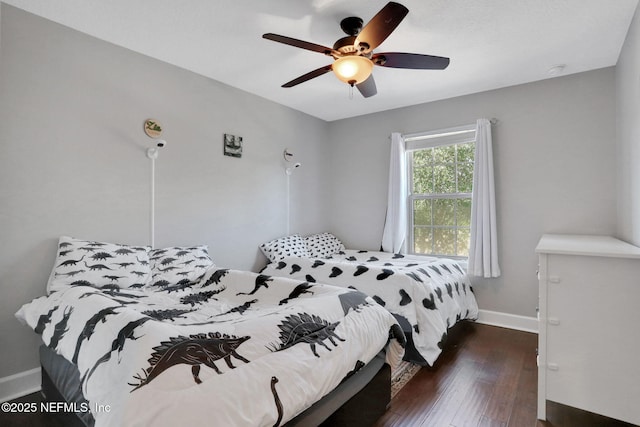 bedroom featuring dark hardwood / wood-style floors and ceiling fan