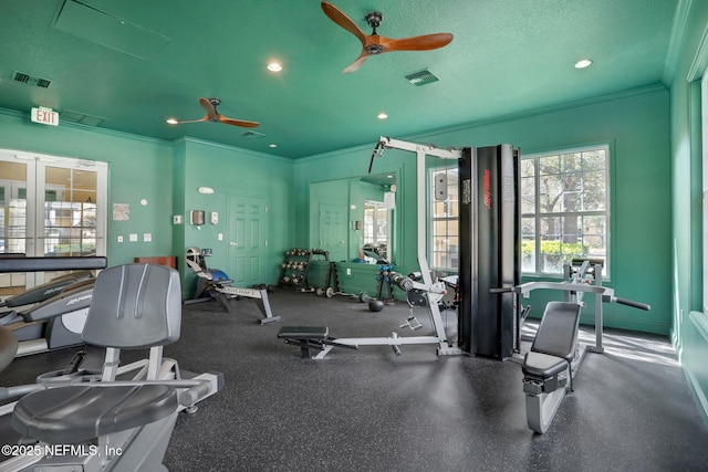 gym featuring crown molding, a textured ceiling, and ceiling fan