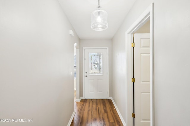 doorway to outside featuring dark hardwood / wood-style flooring