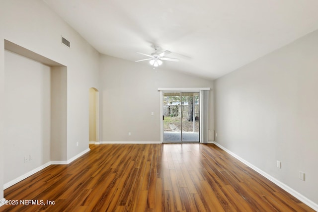 unfurnished room featuring dark wood-type flooring, ceiling fan, and vaulted ceiling