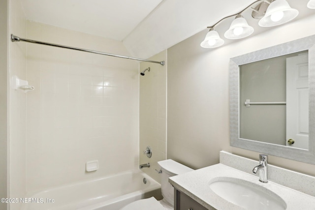 full bathroom featuring vanity, toilet, and tiled shower / bath combo