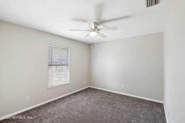 spare room featuring ceiling fan and carpet