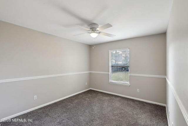 spare room with ceiling fan and carpet