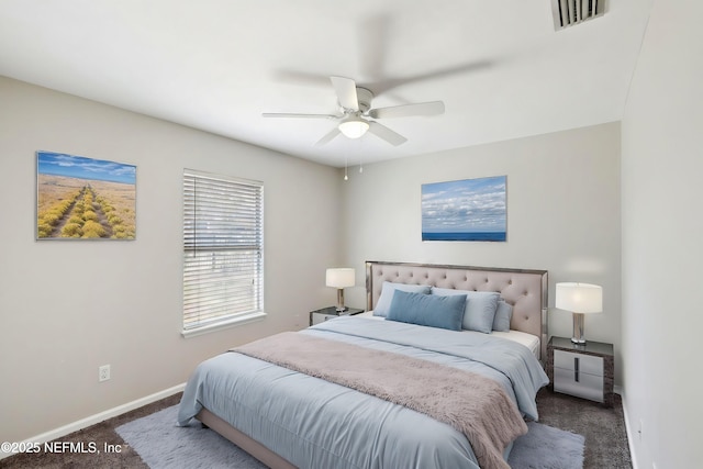 bedroom with dark colored carpet and ceiling fan