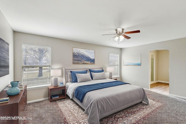 carpeted bedroom featuring ceiling fan