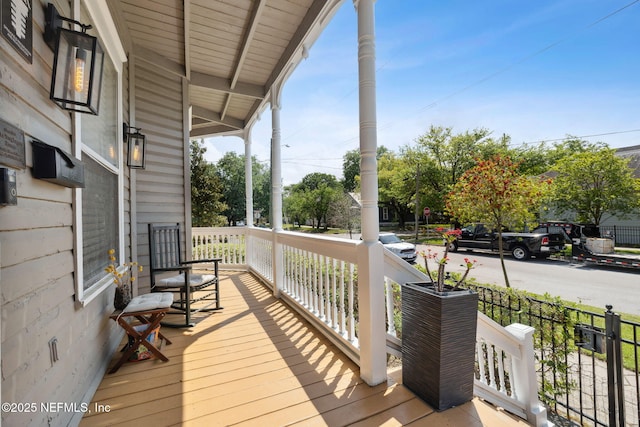 wooden terrace featuring covered porch