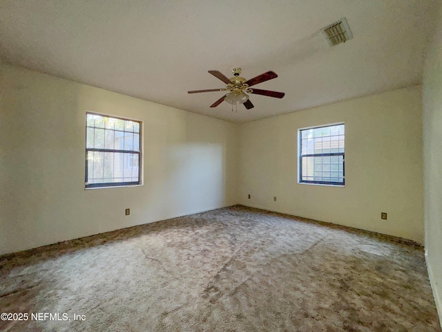 empty room with carpet and ceiling fan