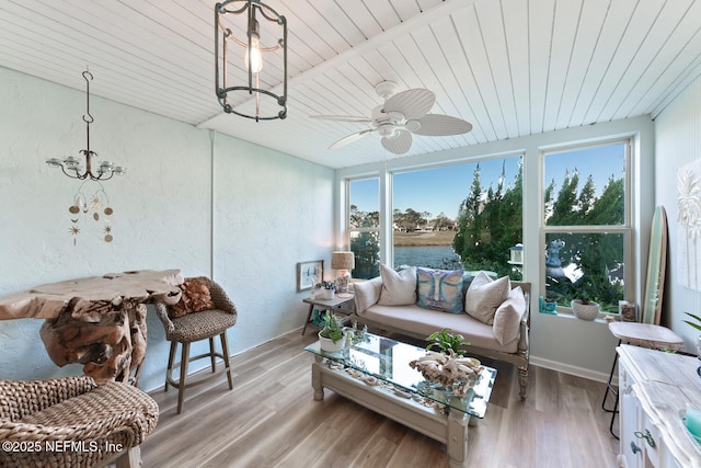 sunroom / solarium with wooden ceiling and ceiling fan