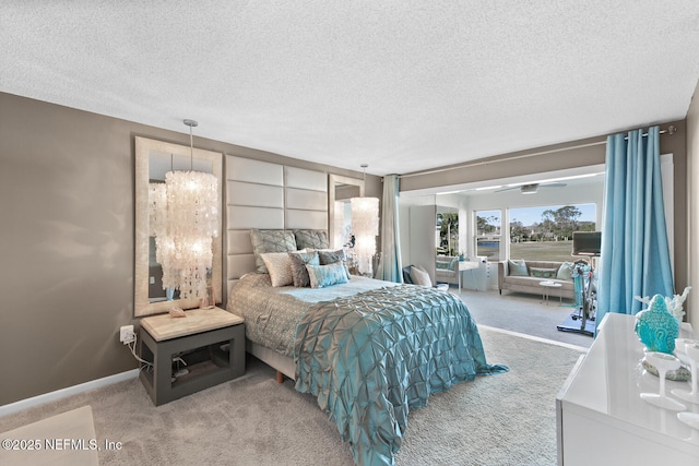 carpeted bedroom featuring a textured ceiling