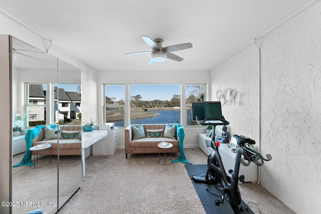 sunroom / solarium featuring ceiling fan