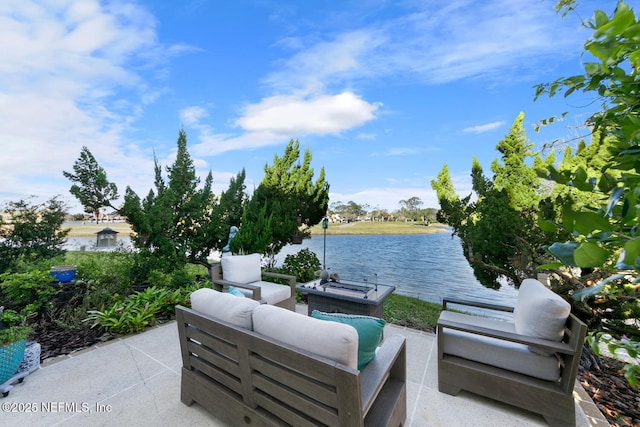 view of patio featuring an outdoor living space and a water view