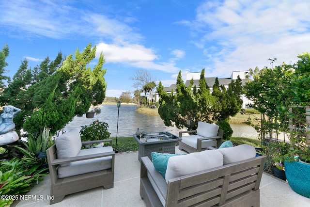 view of patio with a water view and outdoor lounge area