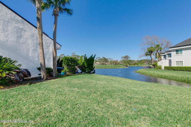 view of yard with a water view