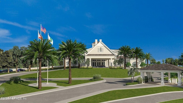 surrounding community with a gazebo and a lawn