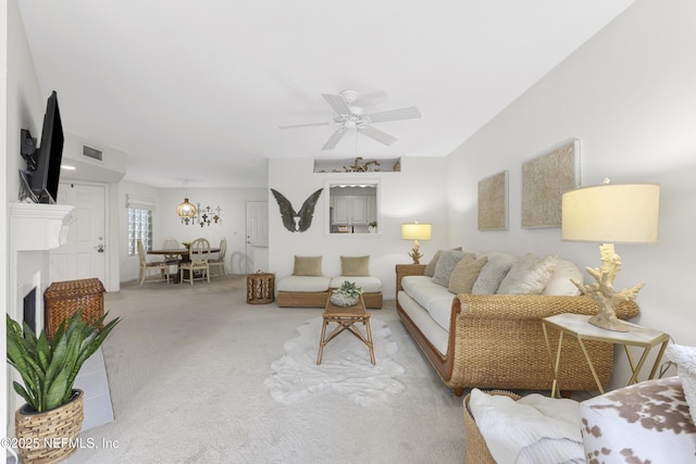 living room with carpet floors and ceiling fan