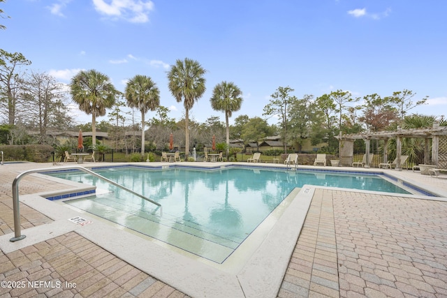 view of swimming pool with a pergola and a patio area