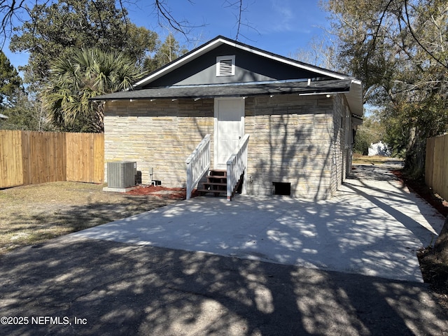 exterior space featuring cooling unit and a patio