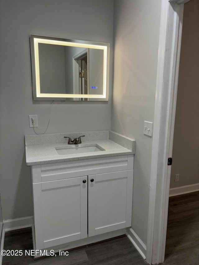 bathroom featuring wood-type flooring and vanity