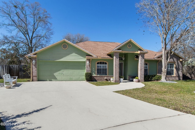 ranch-style house featuring concrete driveway, a garage, fence, and brick siding