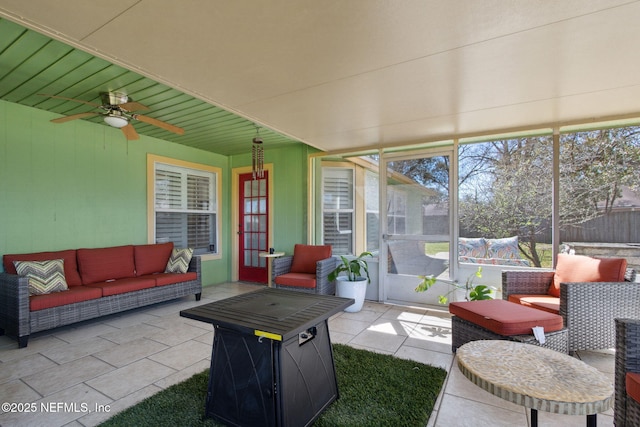 sunroom featuring ceiling fan