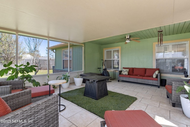 view of patio / terrace with ceiling fan, fence, and an outdoor hangout area