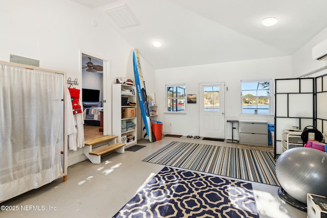 workout room with vaulted ceiling