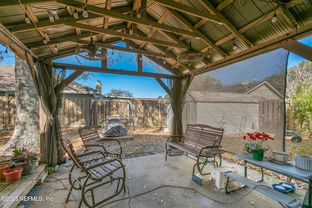 view of patio with a gazebo and ceiling fan