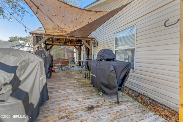 wooden terrace with area for grilling