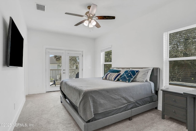 bedroom featuring light carpet, access to outside, ceiling fan, and french doors