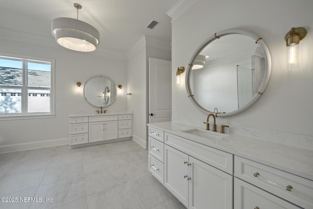 bathroom featuring crown molding and vanity