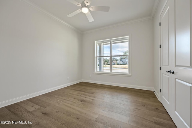 empty room with ornamental molding, ceiling fan, and light hardwood / wood-style flooring