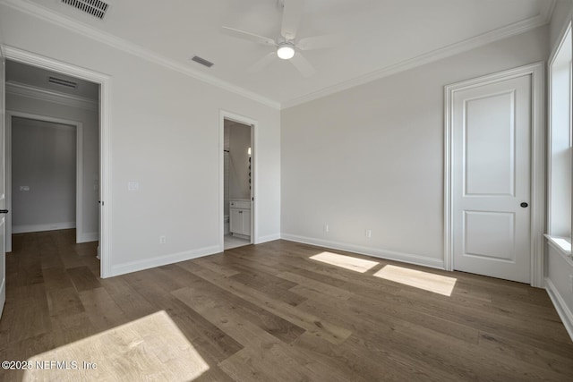 unfurnished bedroom with crown molding, ensuite bathroom, ceiling fan, and hardwood / wood-style flooring