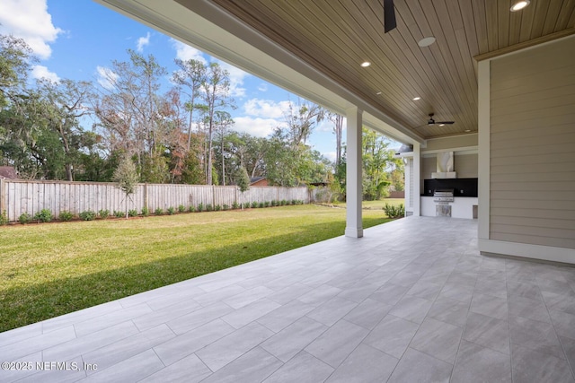 view of patio / terrace featuring exterior kitchen and ceiling fan