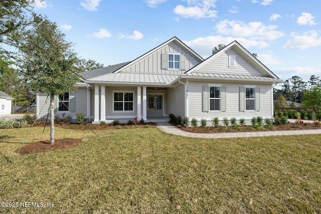 view of front of property with a porch and a front yard