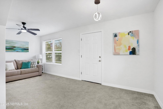 living room with light carpet and ceiling fan