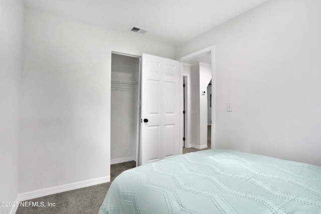 carpeted bedroom featuring a closet