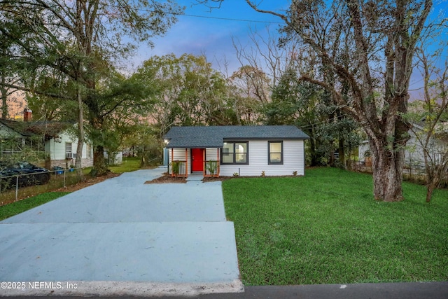 view of front of home with a yard