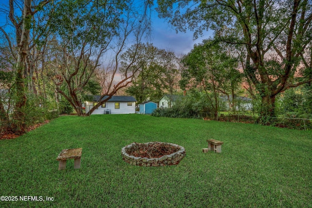 view of yard at dusk