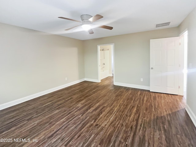 interior space with ceiling fan and dark hardwood / wood-style flooring