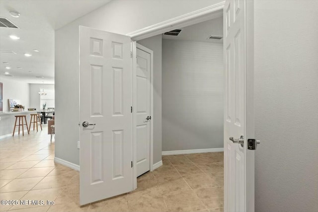 hallway with light tile patterned floors