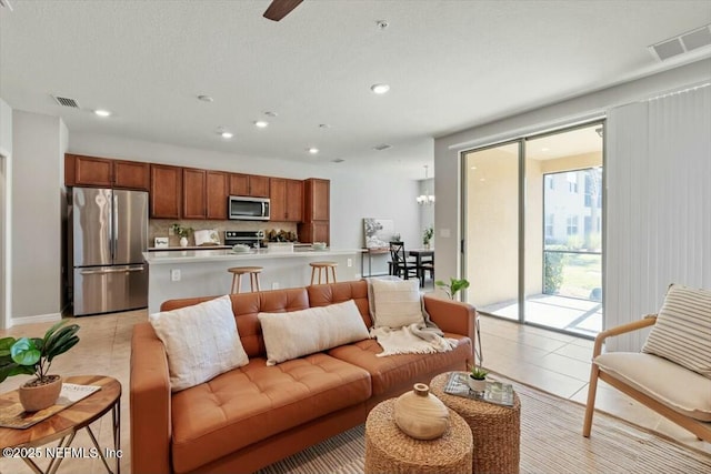 living room with light tile patterned flooring