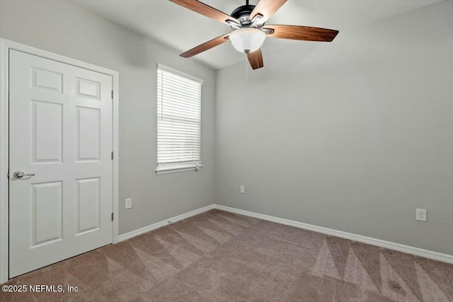 empty room with light carpet and ceiling fan