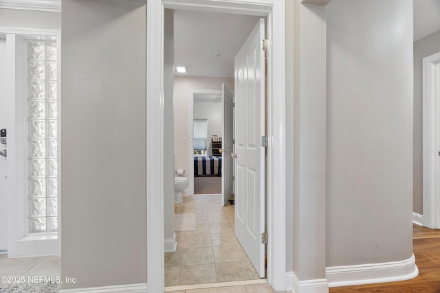 hallway with light tile patterned floors