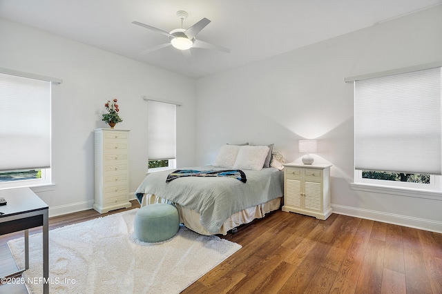 bedroom featuring dark hardwood / wood-style flooring and ceiling fan