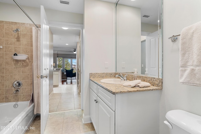 full bathroom with shower / tub combo with curtain, ceiling fan, tile patterned flooring, vanity, and toilet