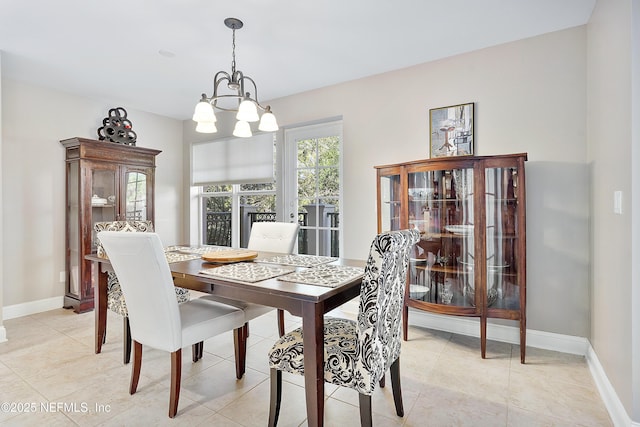 dining space featuring a notable chandelier