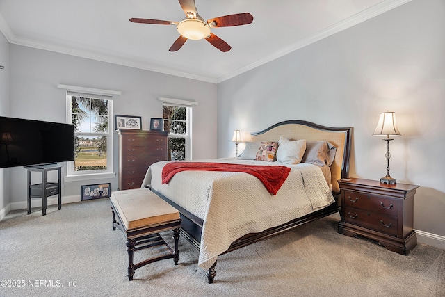 bedroom with ceiling fan, ornamental molding, carpet flooring, and multiple windows